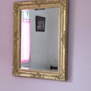 Miroir ancien doré richement sculpté