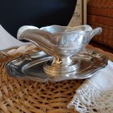 Sauce boat on a scalloped tray in silver metal