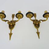 Pair of double-light Empire style arrow wall lights in bronze. Early 20th century