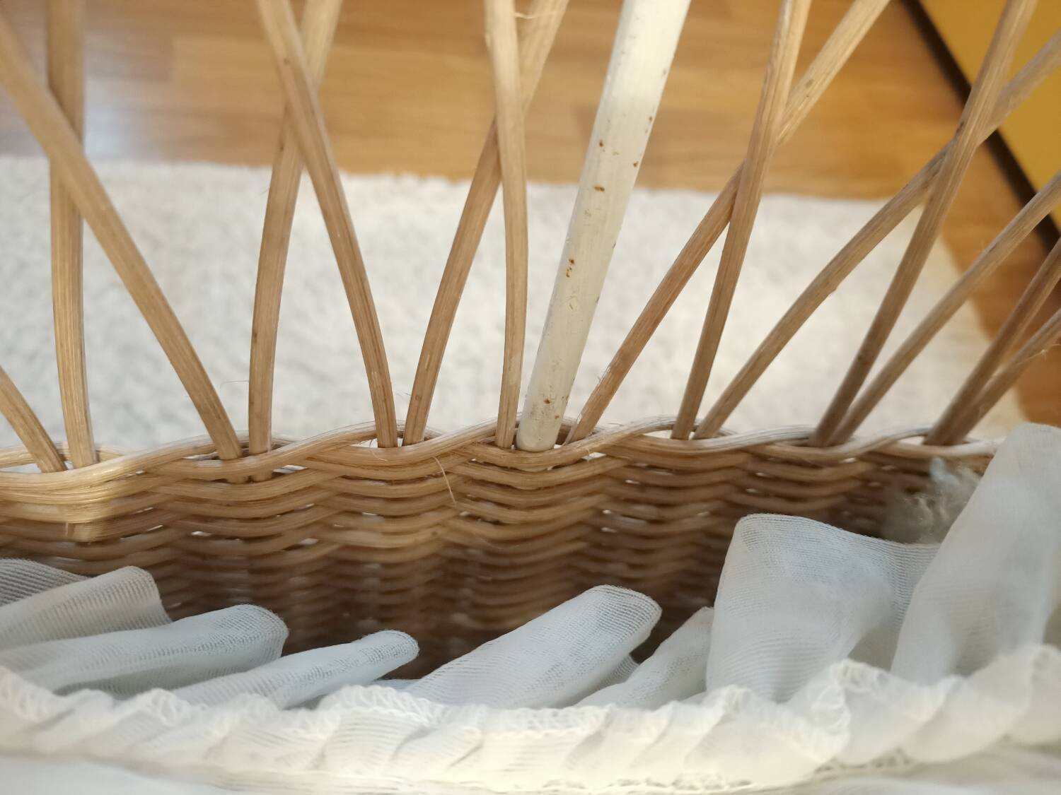 Rattan and wrought iron cradle