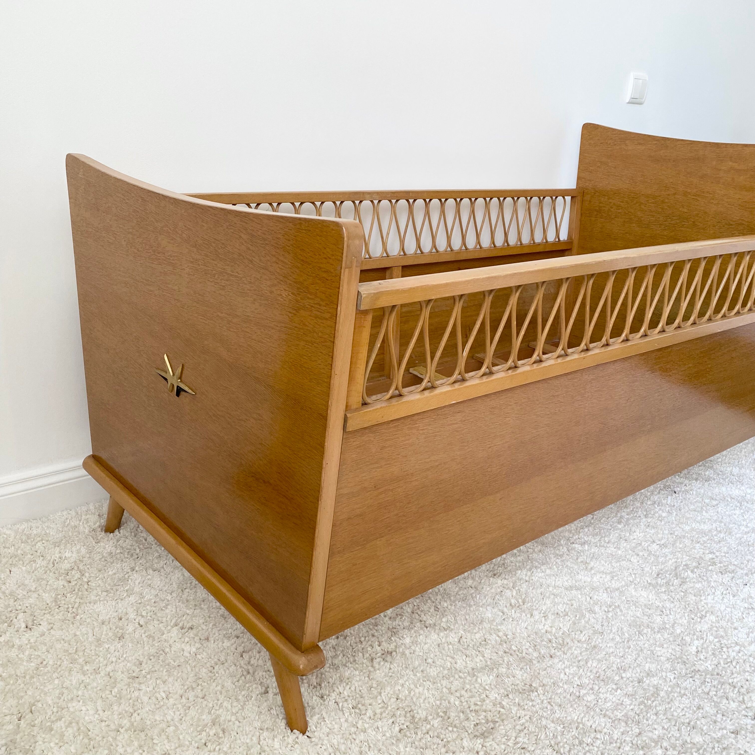 Vintage wooden baby cot and rattan strap