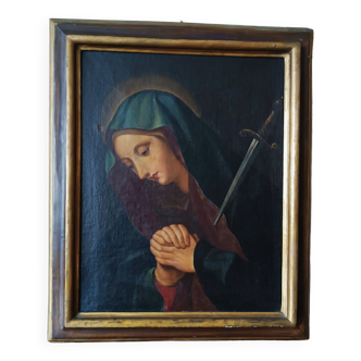 Old painting Madonna of Sorrows with antique frame