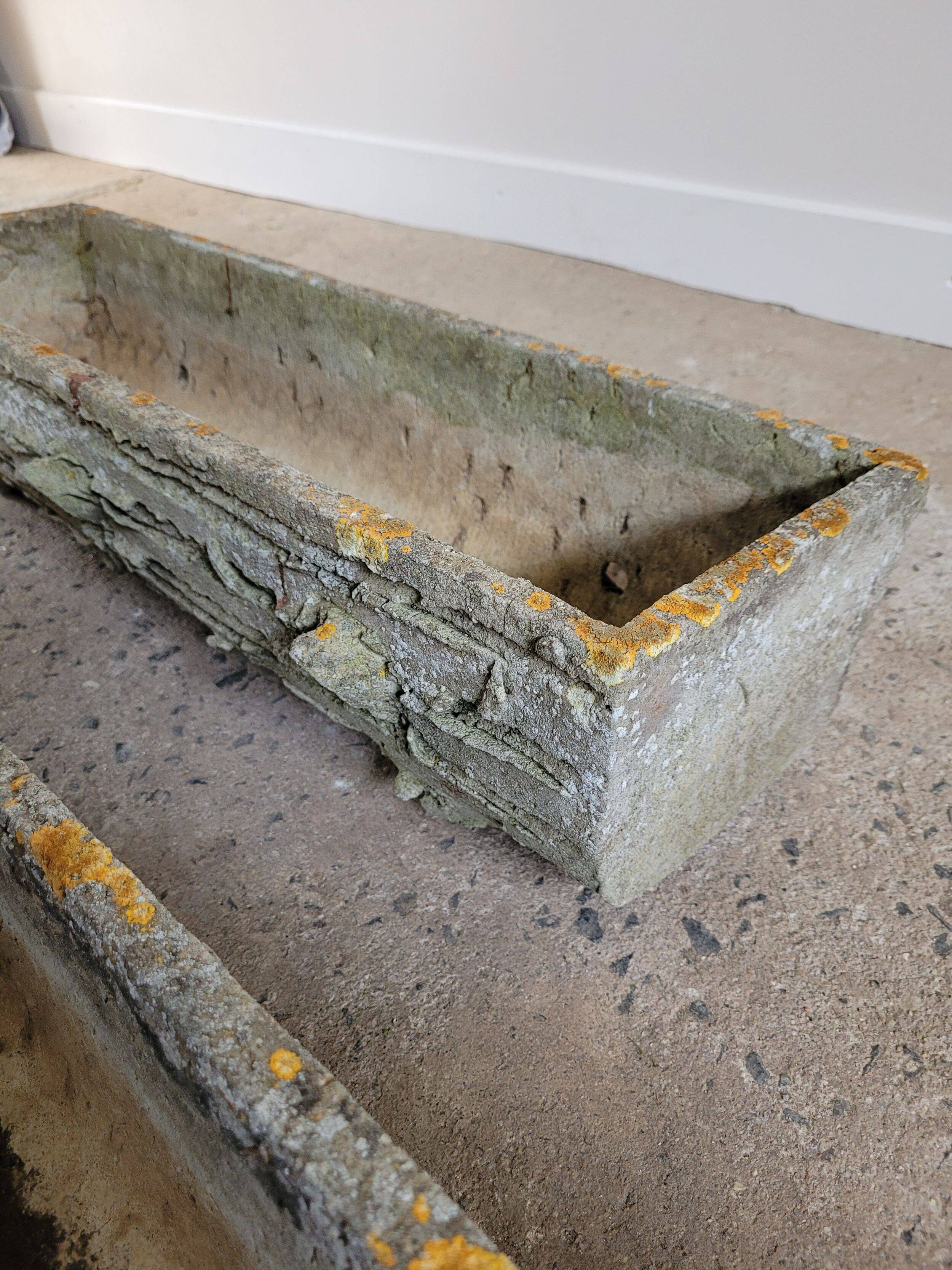 Old planters in faux cement wood