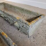 Old planters in faux cement wood