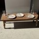Tray, circular dish or plate made of white striped grey petrified wood.