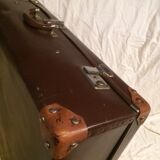 Suitcase vintage leather inside and brown carpeted home