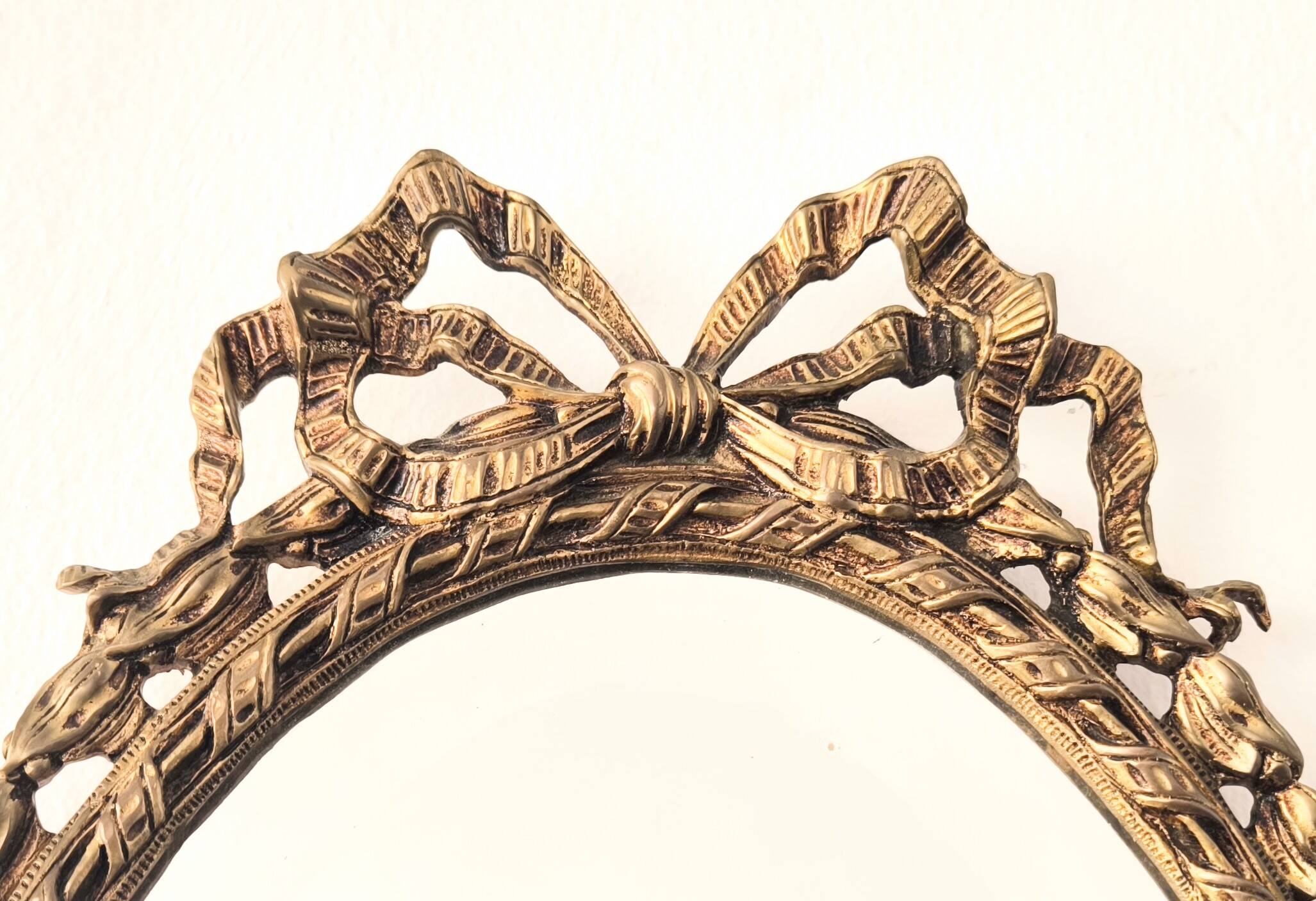 Bronze mirror in Hollywood Regency style from the 1940s/50s.