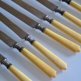 11 antique 19th-century table knives with ivory-colored monogram handles