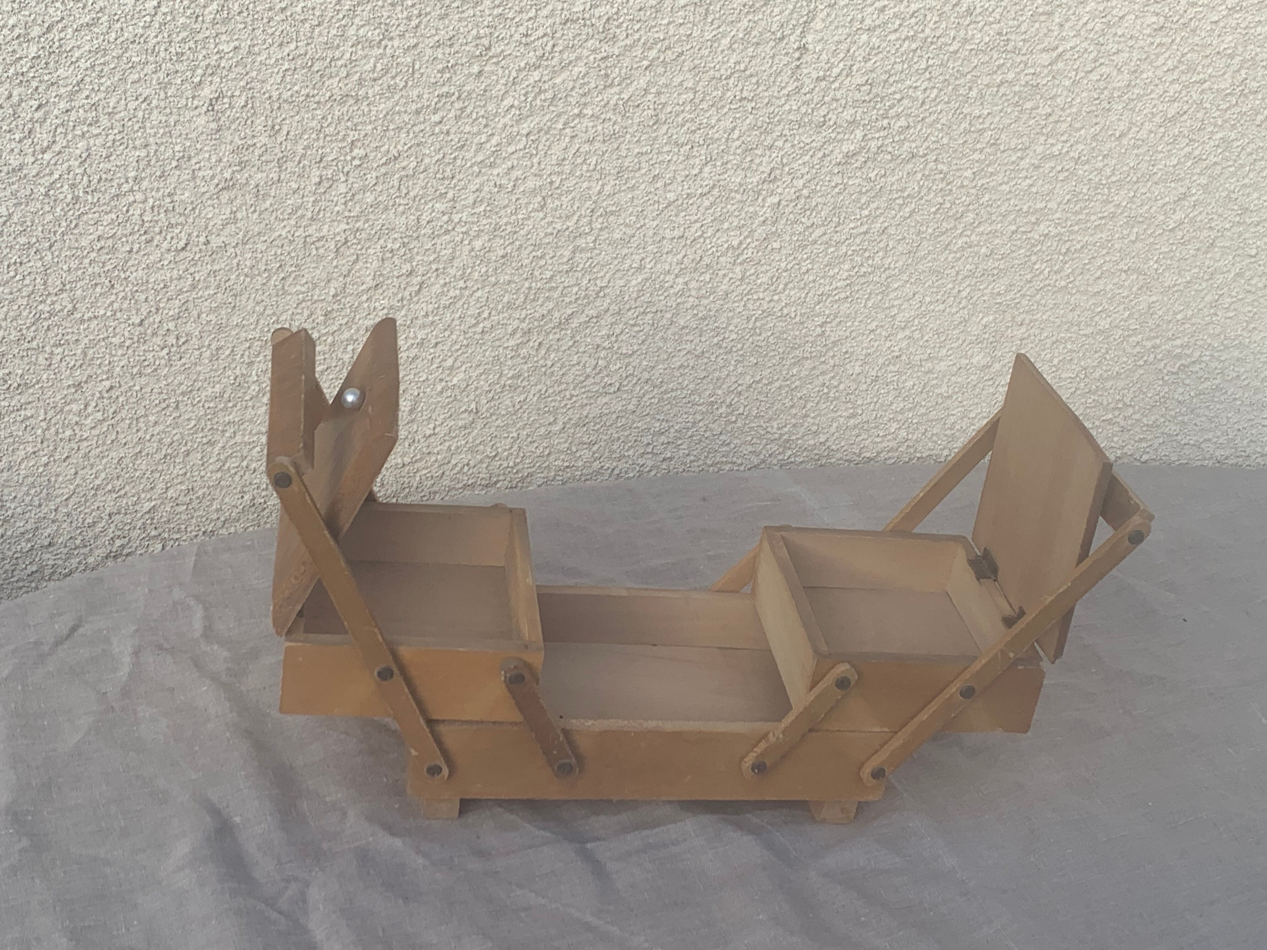 Sewing box in old varnished wood