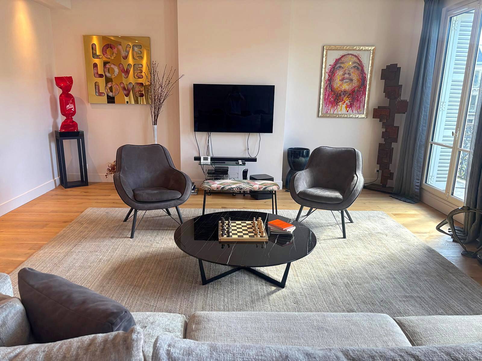 Pair of Joe PMP furniture armchairs in anthracite grey fabric.