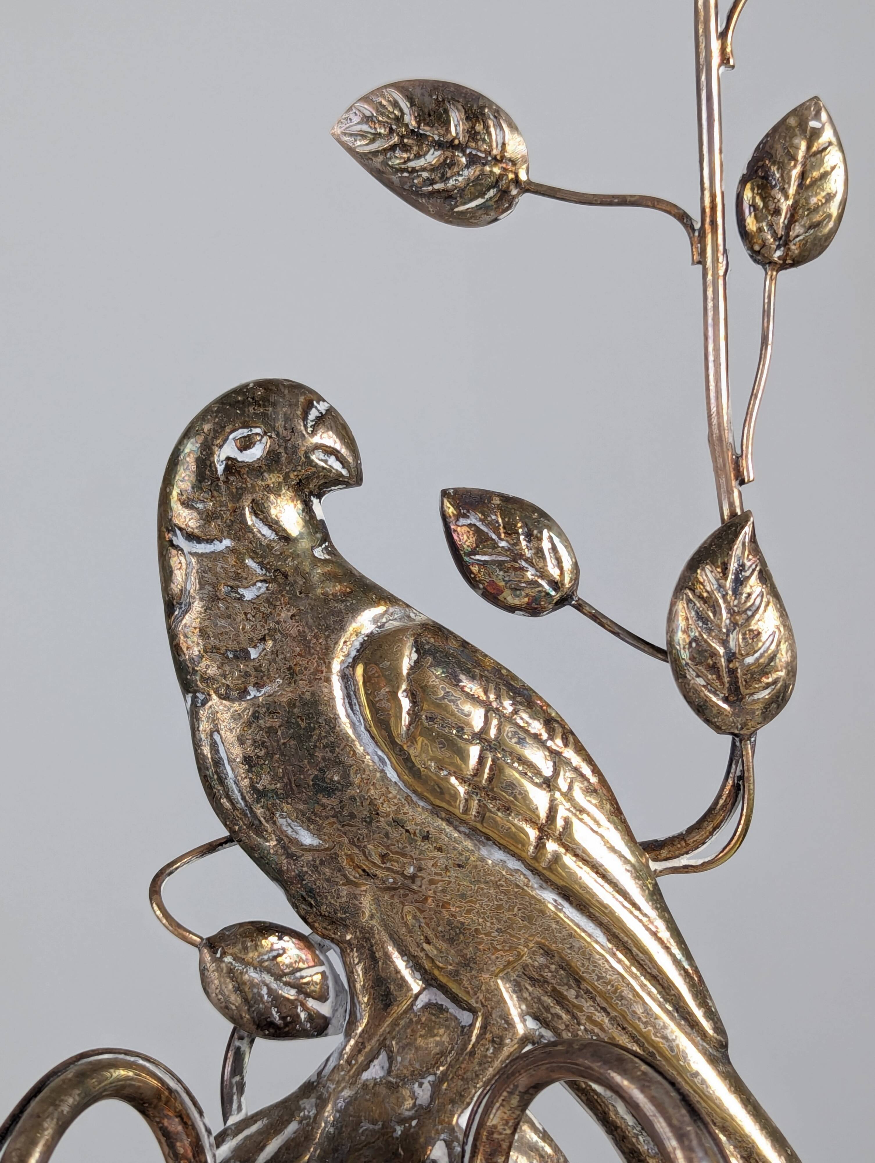 Pair of wall sconces with parrots and leaves