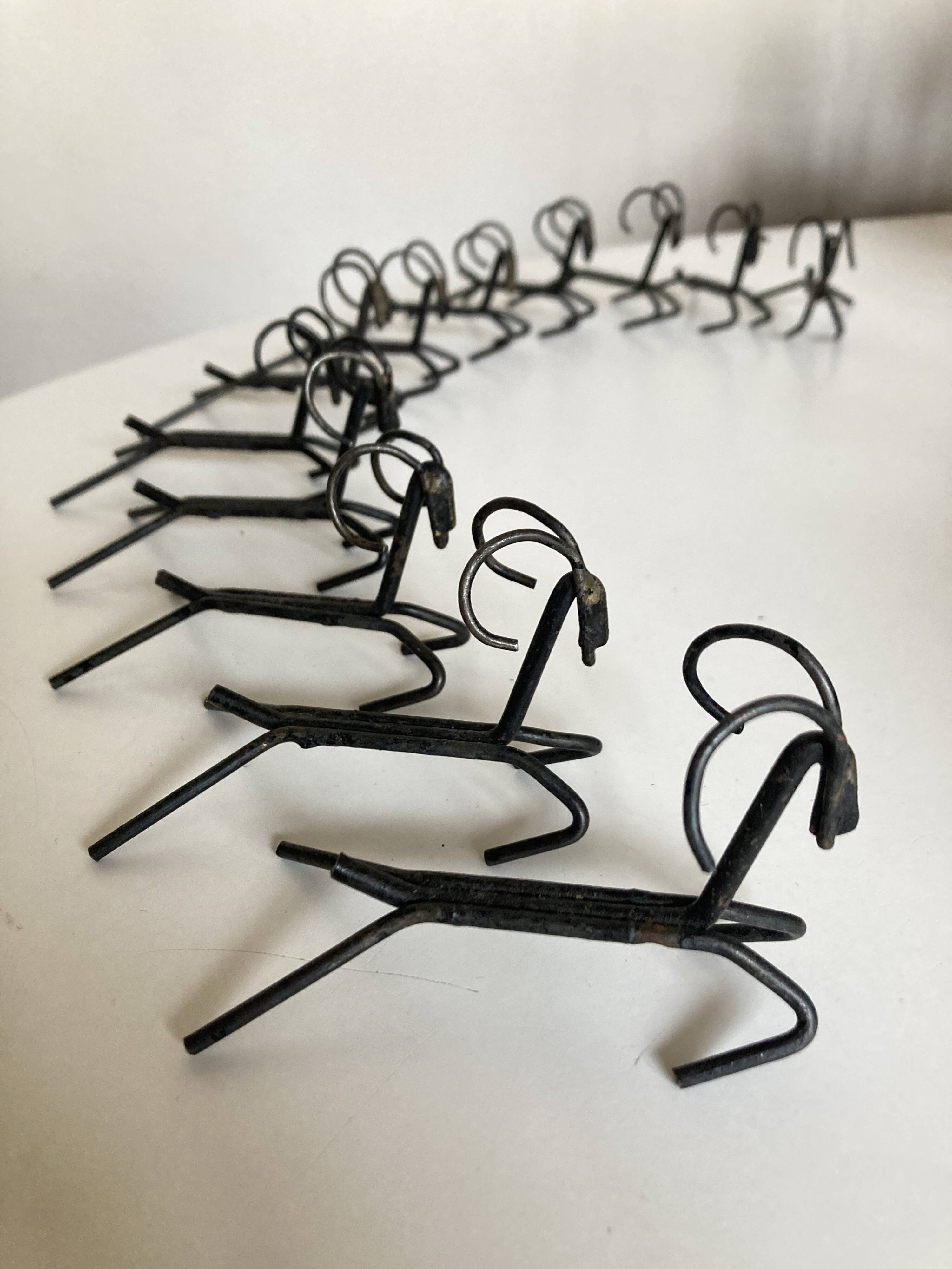 Set of 12 raw iron knife rests 1970