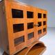Mid-century modern mobile bar cabinet with sculptural base, 1950s.