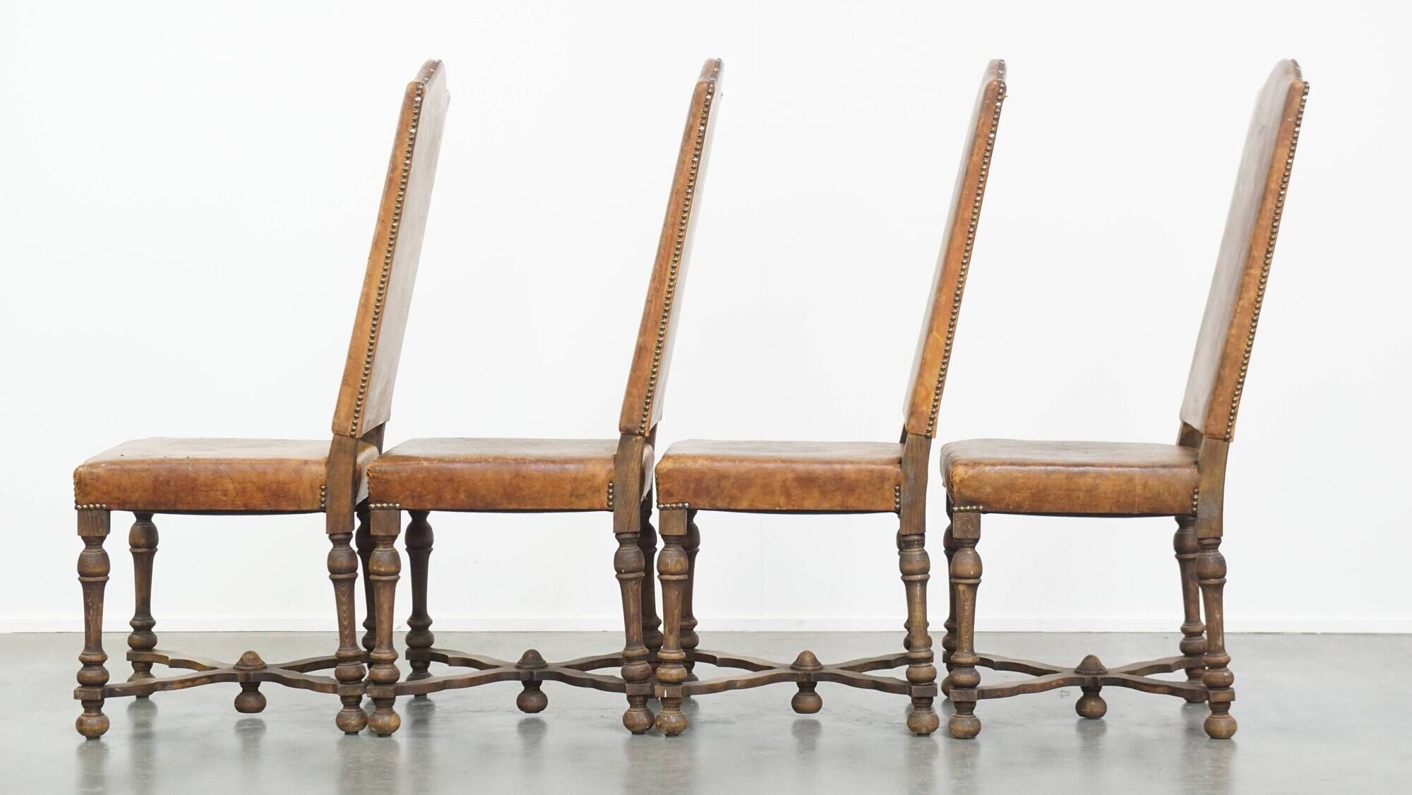 Set of 4 antique wooden and sheepskin leather dining chairs