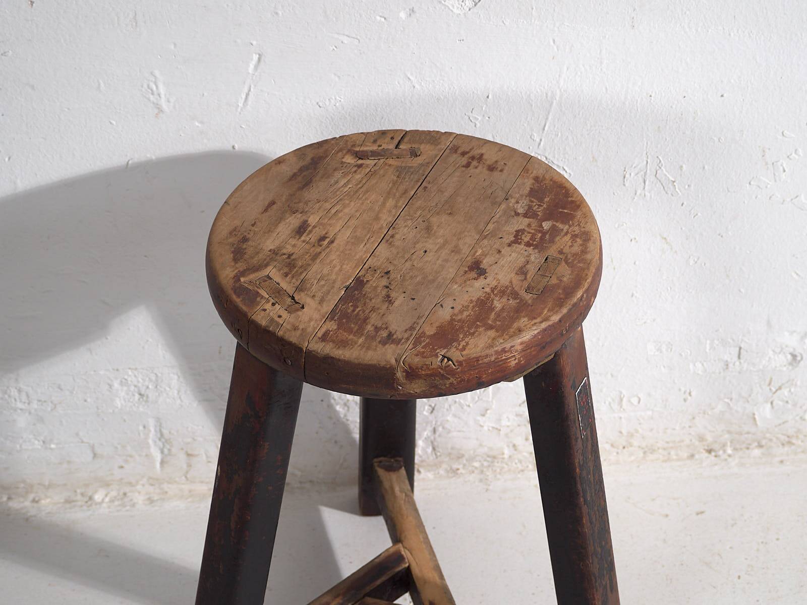 Antique round dark colored stool (c.1900)