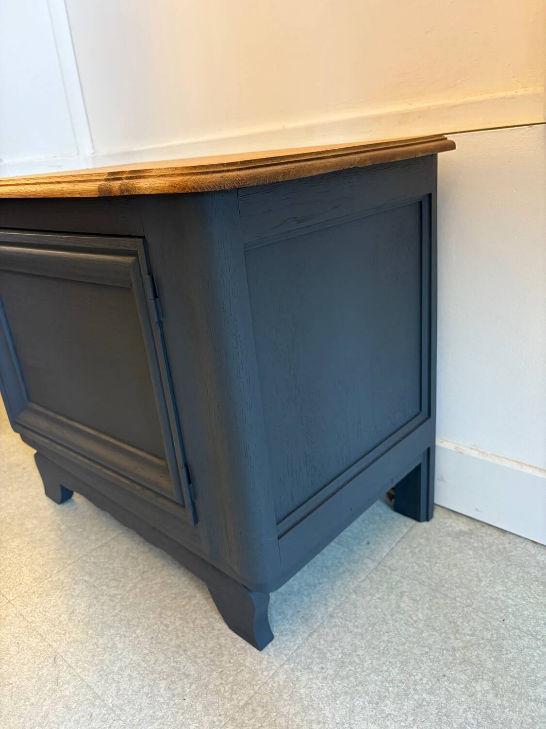 Mat black storage furniture, natural top.