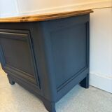 Mat black storage furniture, natural top.