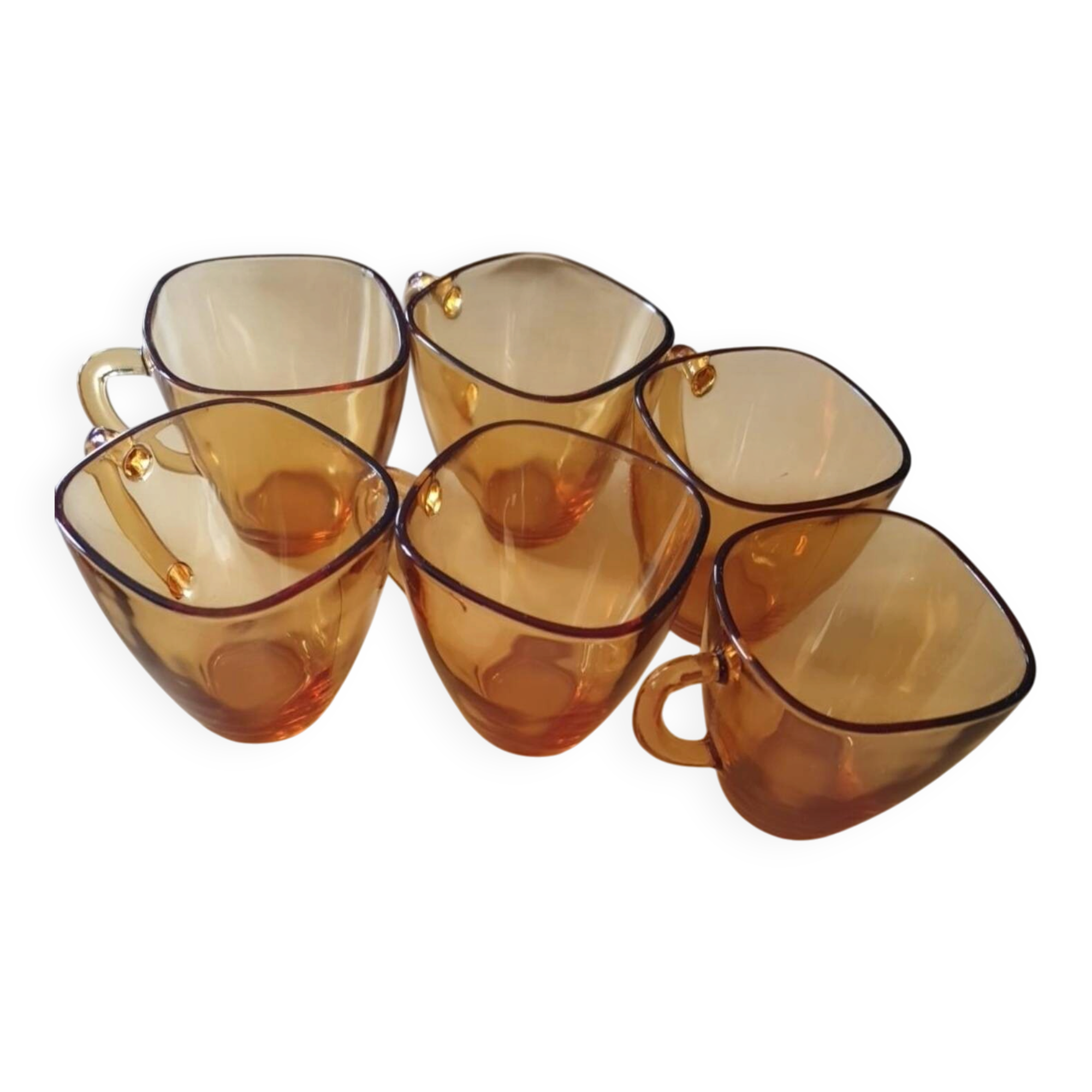 Service of 6 cups and saucers in amber glass.