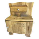 Raw wood bedside table