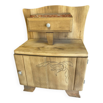 Raw wood bedside table
