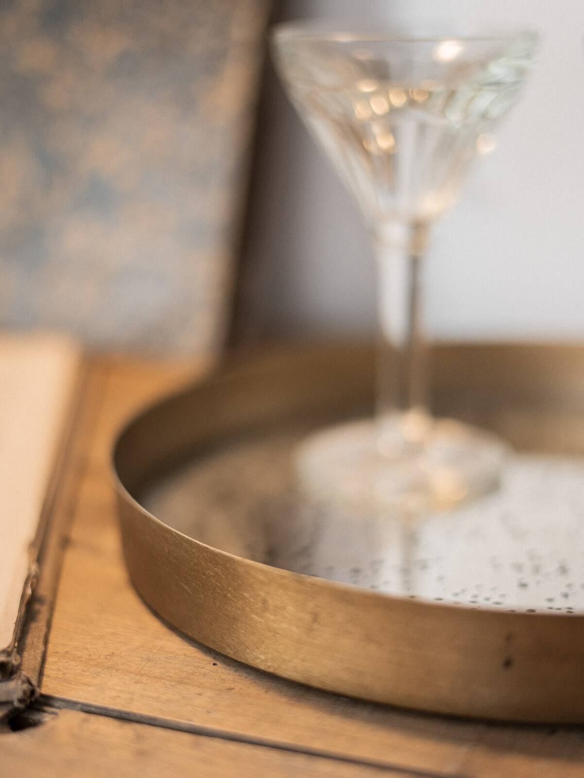 Patinated mirrored top and brass