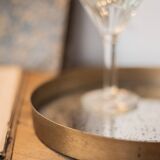 Patinated mirrored top and brass