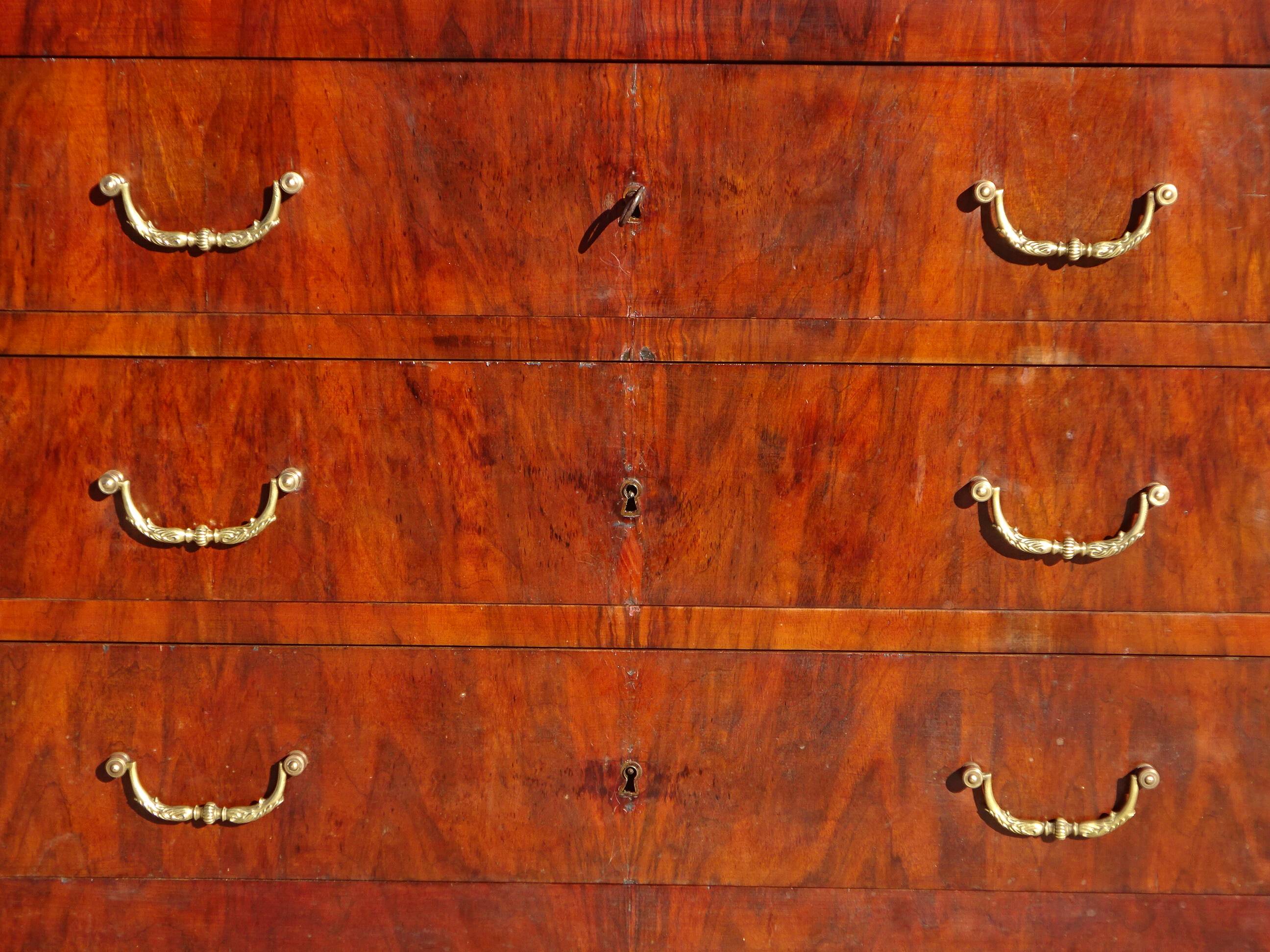 Antique mahogany chest of drawers with white marble.