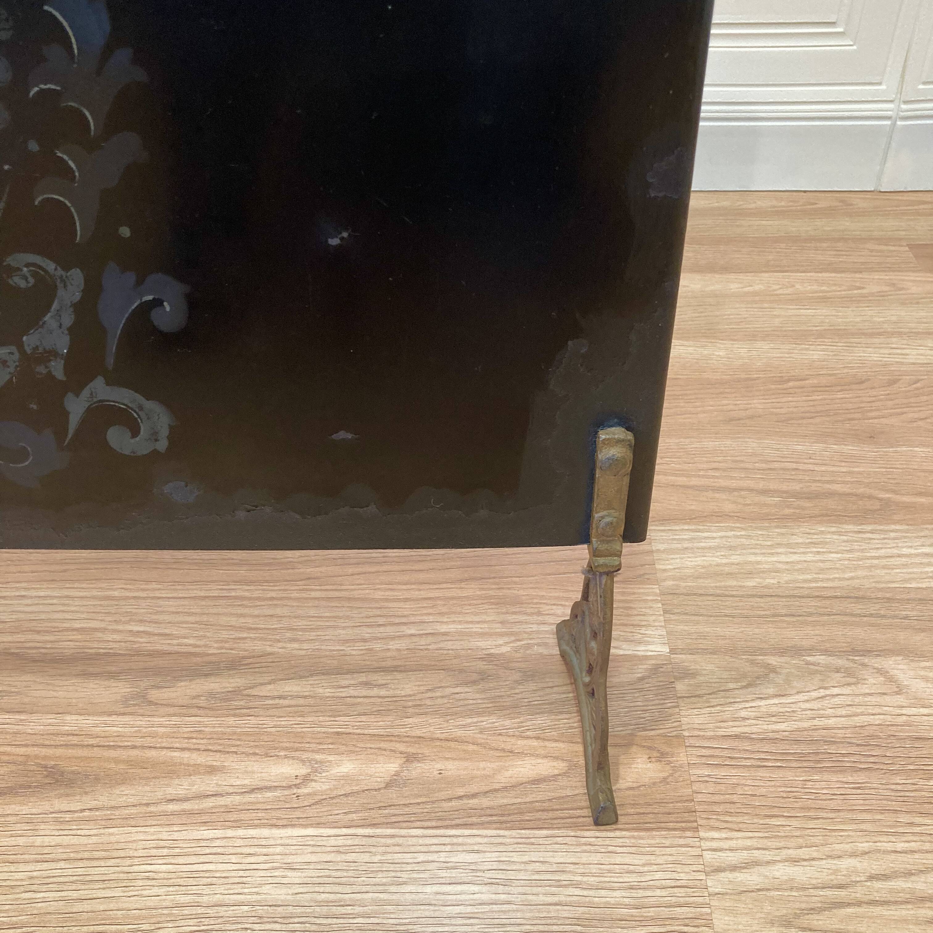 Antique metal fireplace screen.