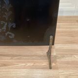 Antique metal fireplace screen.