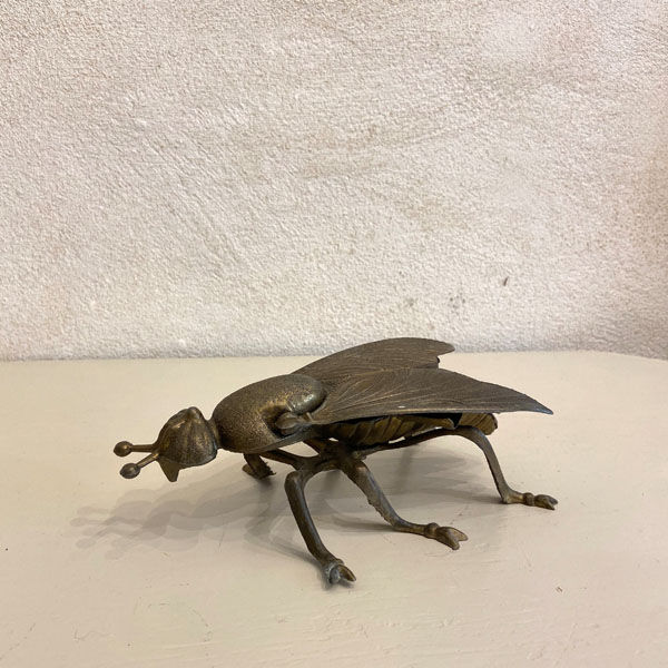 Gold metal ashtray fly