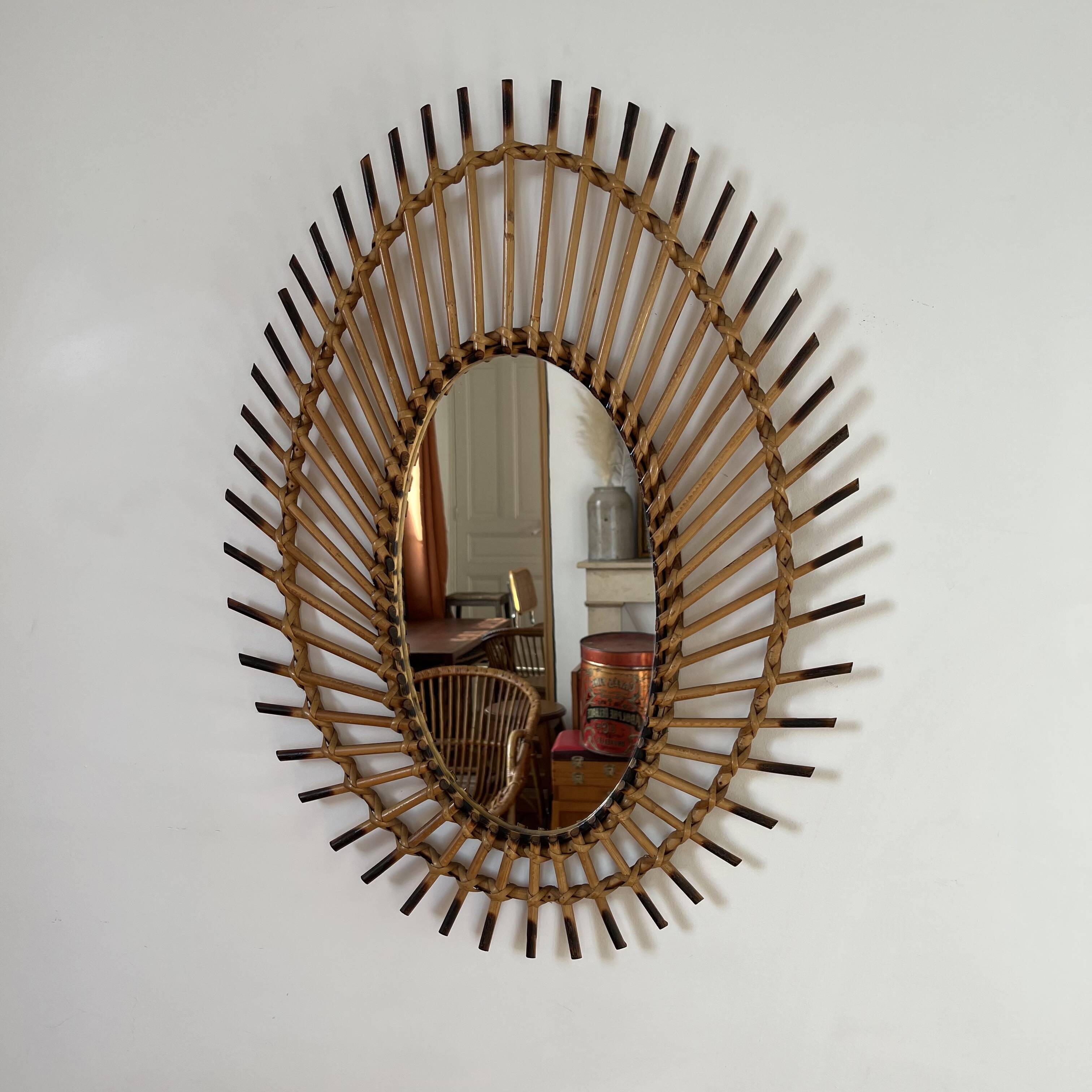 Rattan mirror in the shape of an eye