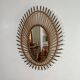 Rattan mirror in the shape of an eye