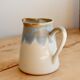 Vintage ceramic milk jug with a blue and taupe gradient glaze.