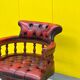 Chesterfield Revolving Captain's Chair with Red Leather Upholstery