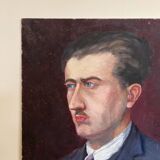 Old oil painting on cardboard portrait of a man in a blue suit