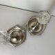 Pair of silver-plated metal candlesticks