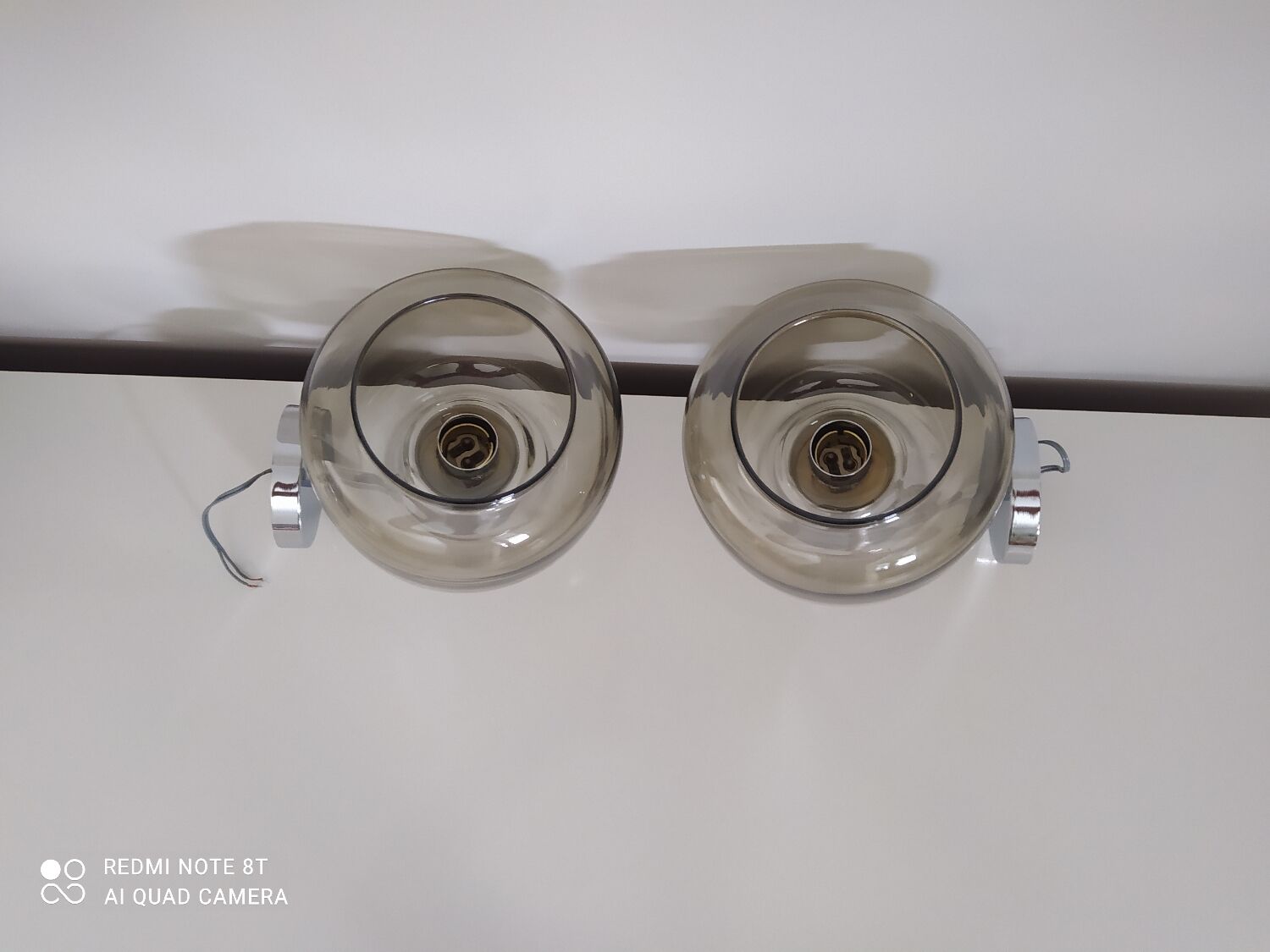 Pair of vintage chrome wall lights with smoked glass globe
