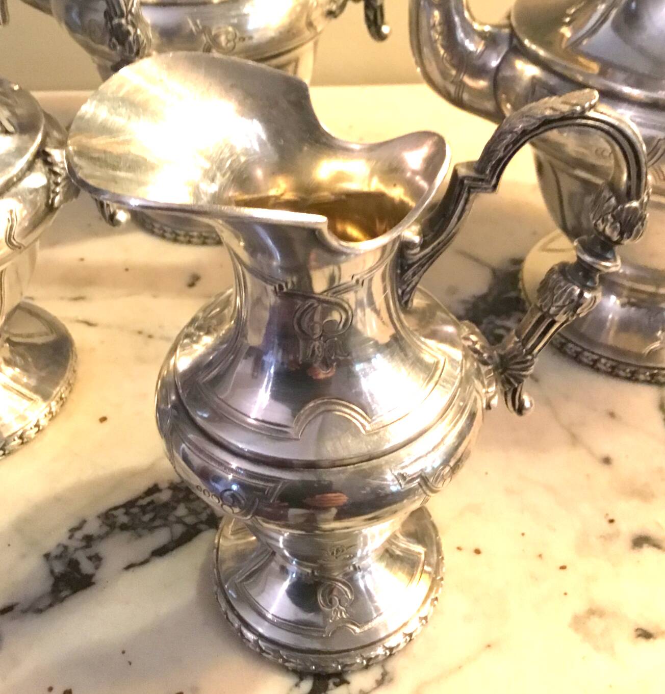 Silver-plated metal tea and coffee service in a 4-piece style.