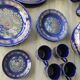 Vintage blue Taous dinnerware set of 21 pieces in very good overall condition.