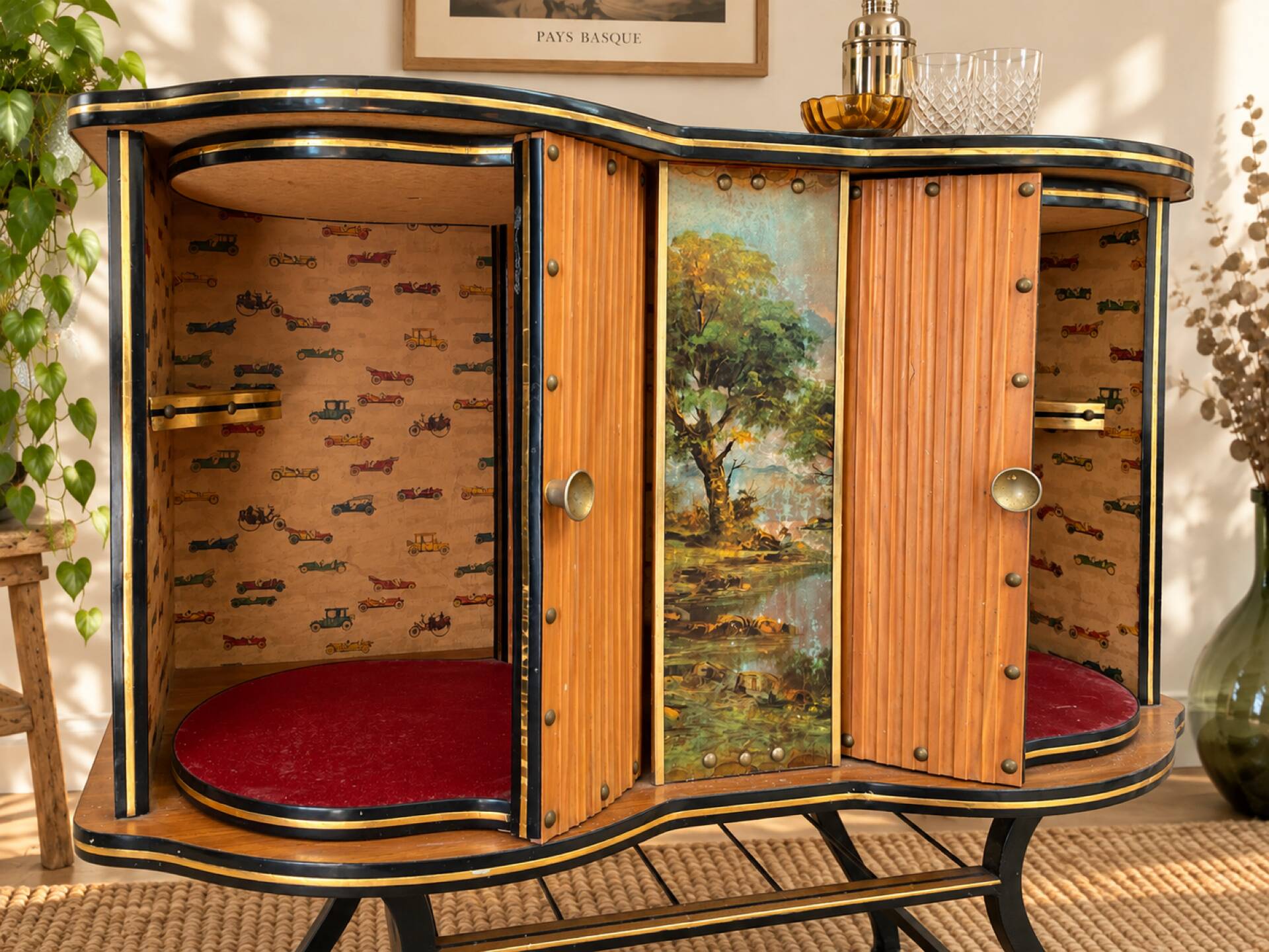 Vintage bar on wheels with tambour doors and painted decor – 1950s.