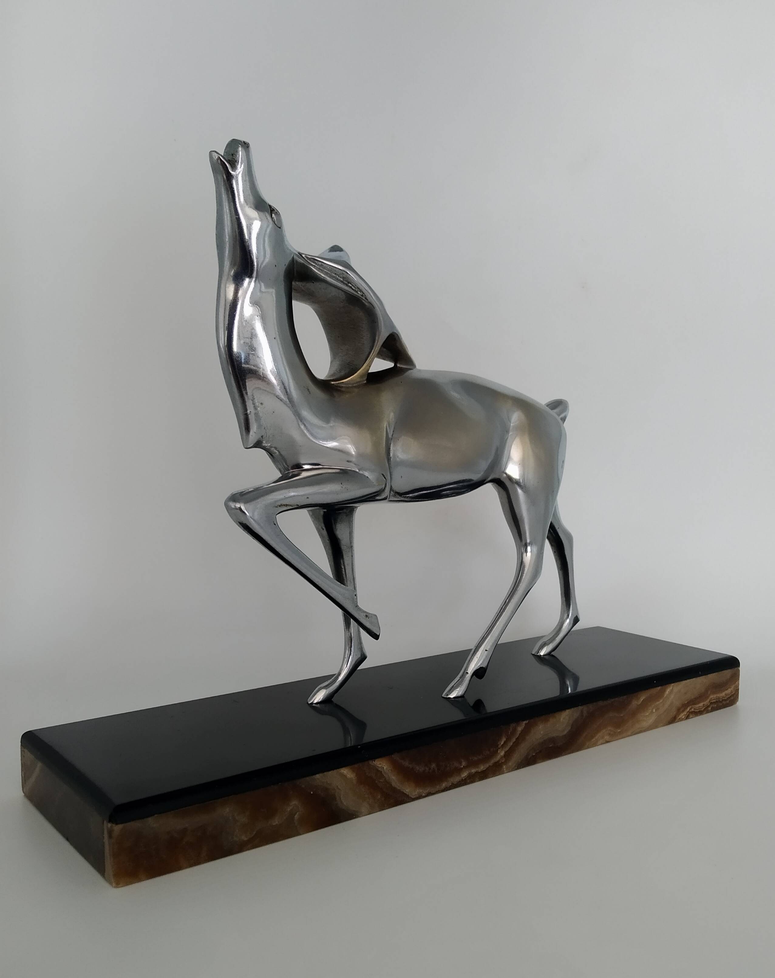 Silvered bronze sculpture signed by Michel Decoux.