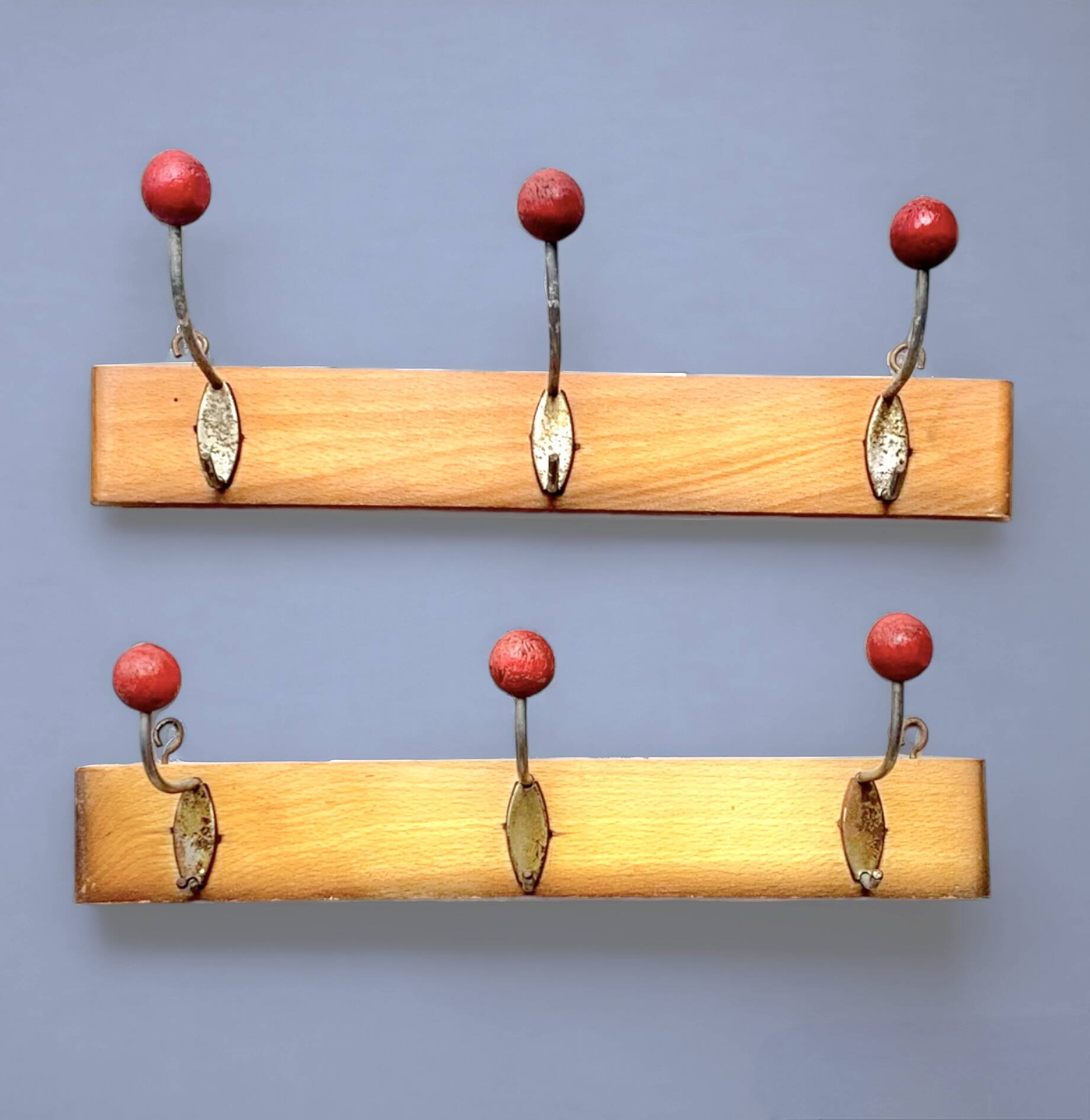 Pair of vintage wooden wall coat racks with three red ball hooks