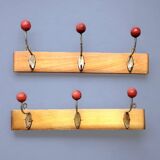 Pair of vintage wooden wall coat racks with three red ball hooks