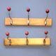 Pair of vintage wooden wall coat racks with three red ball hooks