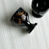 3 black ceramic egg cups with floral patterns