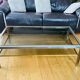 1970s coffee table in brushed metal, brass and smoked glass by Willy R
