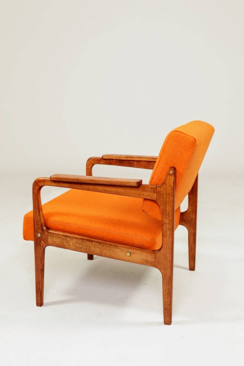 Vintage armchair in papaya orange wool from the 1960s.