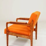 Vintage armchair in papaya orange wool from the 1960s.