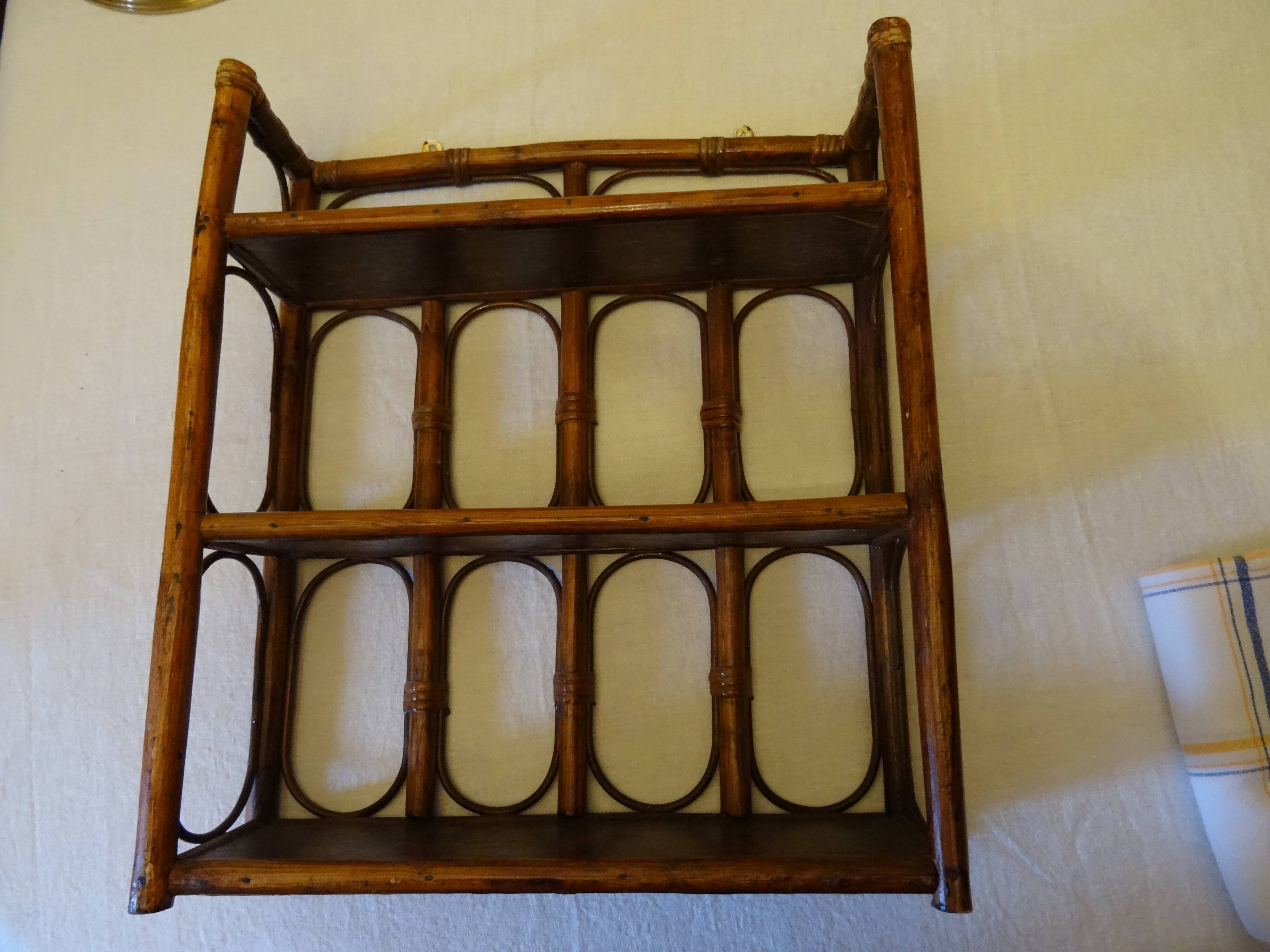 Varnished rattan wall shelf