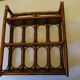 Varnished rattan wall shelf